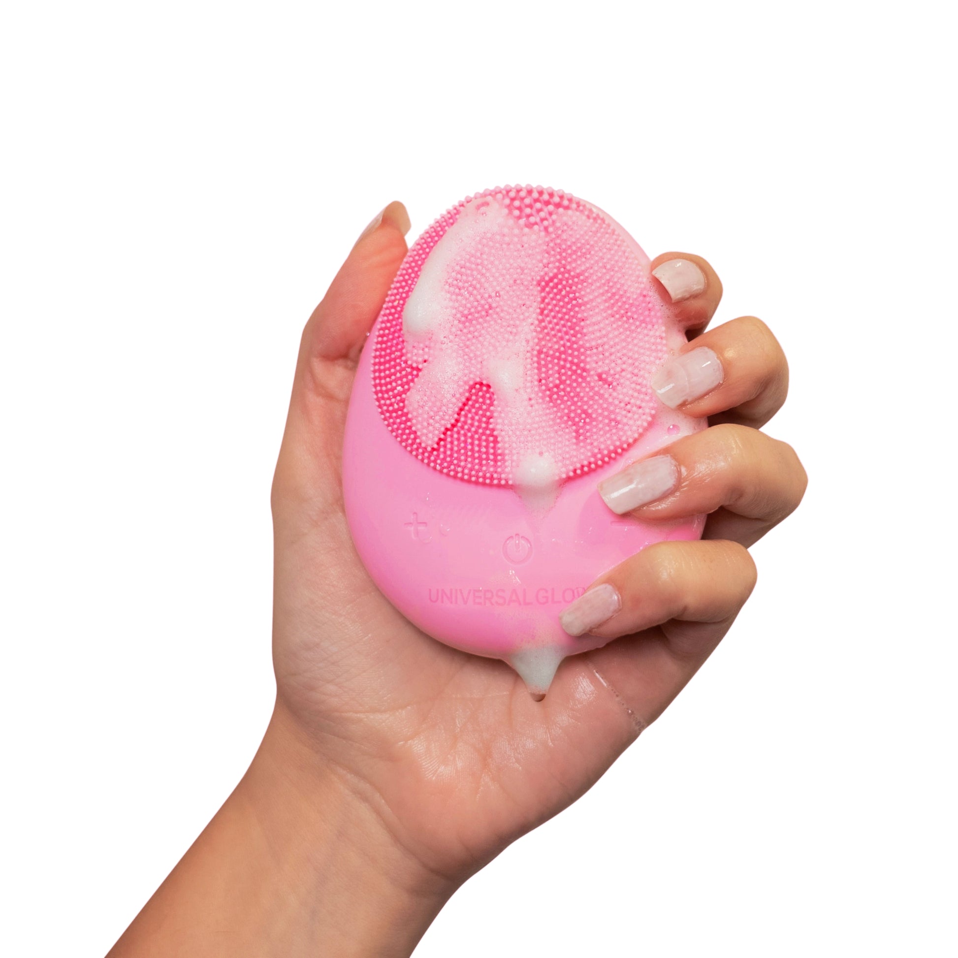 Pink silicone cleansing brush, with hand