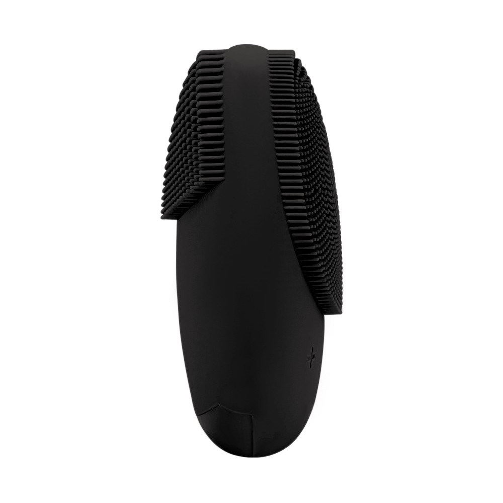 Black silicone face scrubber, side view